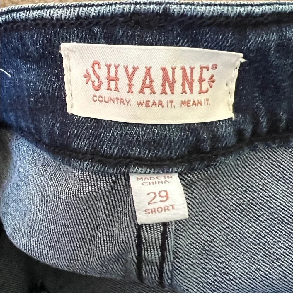 SHYANNE dark wash slit flare leg jeans